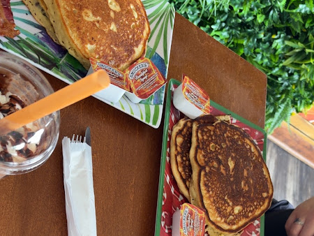 Pancakes with eggs and sausage photographed by Dee Dee in her Google review